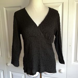 Nomadic Traders black textured top with three quarter sleeves